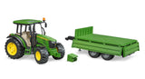 John Deere 5115 M with tipping trailer